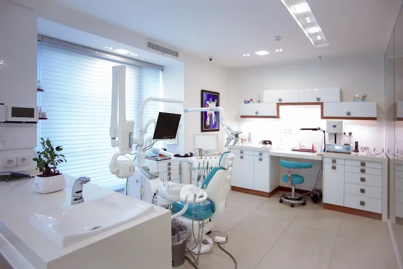 A modern dental practice front desk with appointments, recall lists, and treatment plans flowing in the background