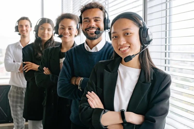 Customer service representative taking a phone call with a headset in a professional setting