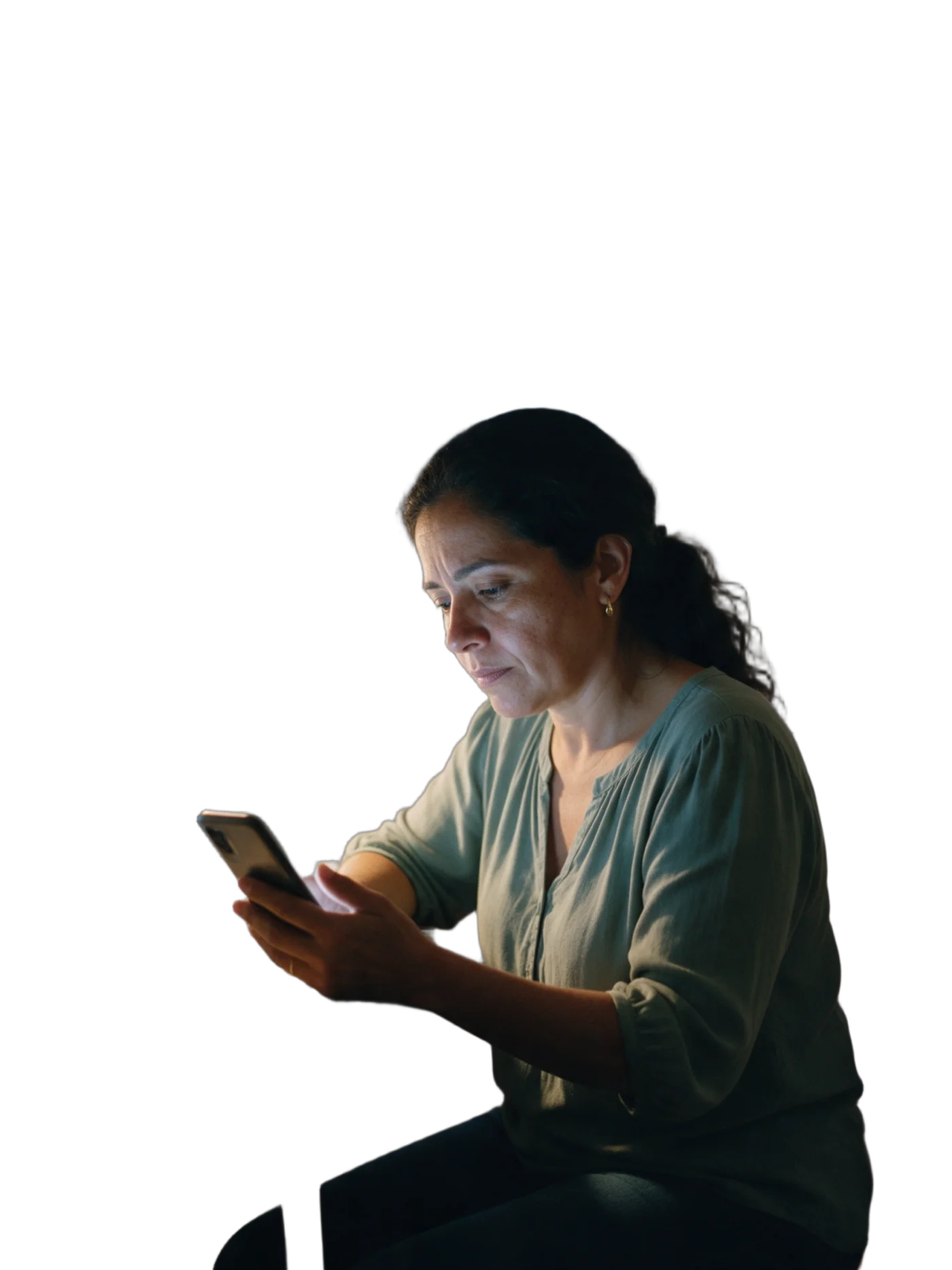 María, in her home office at 7 pm, looks at the phone that just lit up.
